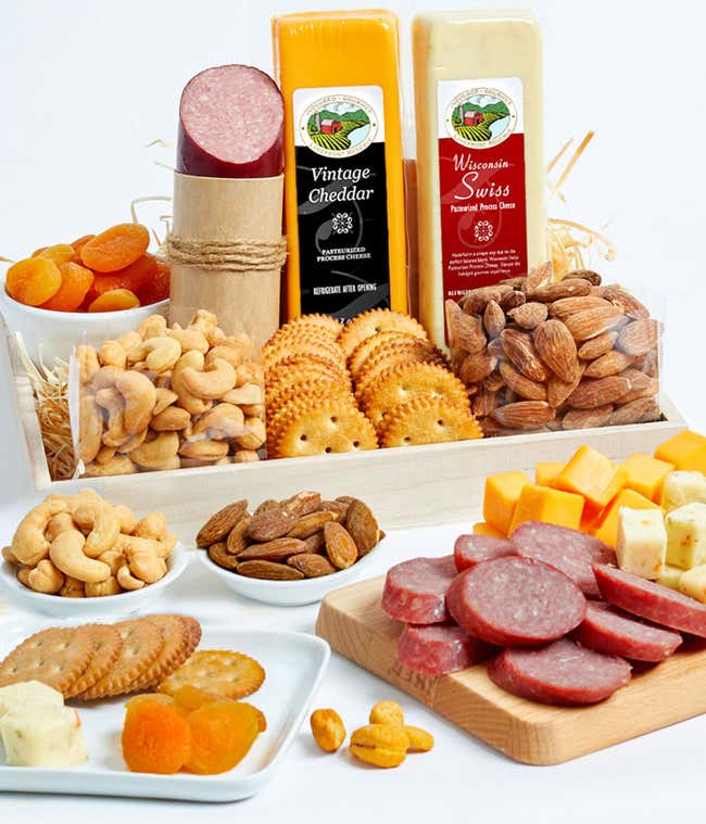 A delightful assortment featuring summer sausage, sharp cheddar cheese, Wisconsin Swiss cheese, almonds, cashews, dried apricots, snack crackers, all elegantly presented on a gift tray.