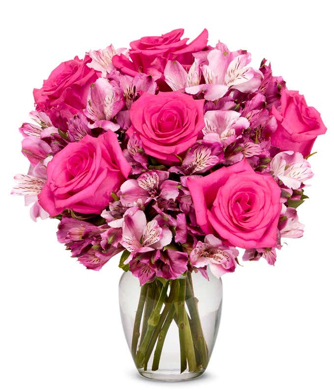 A bouquet featuring pink roses and pink alstroemeria, with an optional glass vase.