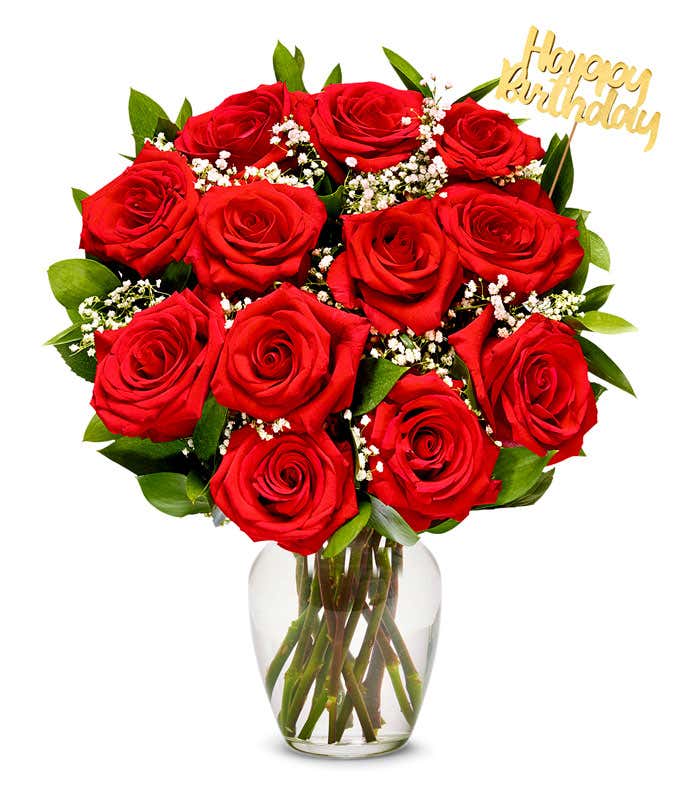 Red roses with baby's breath arranged with a gold Happy Birthday pick