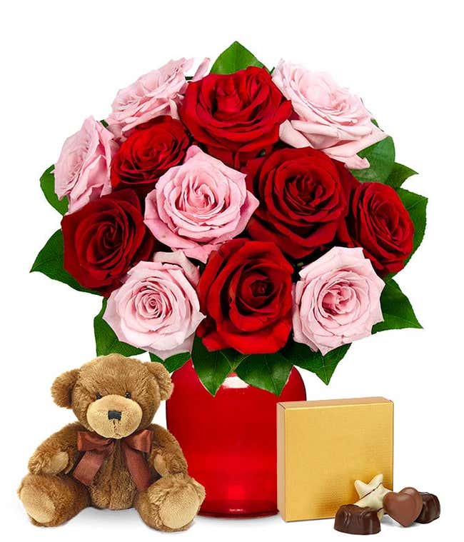 Pink and red roses with chocolates and a bear