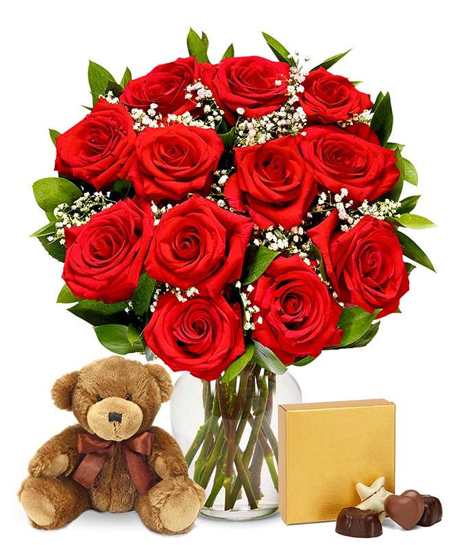 A romantic gift set featuring 12 long stem red roses, a cuddly teddy bear, and a box of chocolates, optionally presented in a vase. This classic combination offers a heartfelt and memorable display for any special occasion.