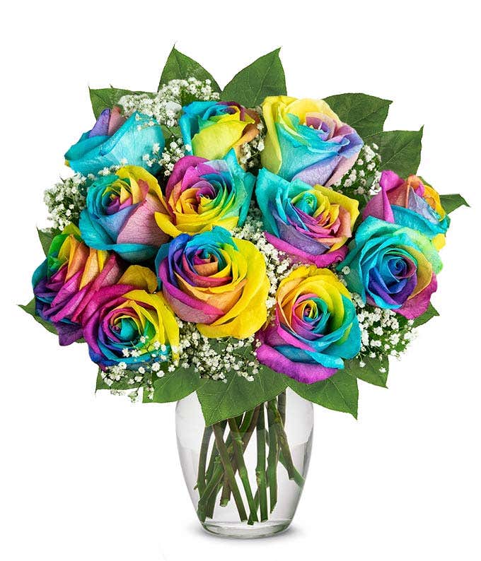 A stunning arrangement featuring 12 wild rainbow roses, optionally presented in a vase. This vibrant and colorful display creates a striking and eye-catching centerpiece, perfect for adding joy and celebration to any occasion.