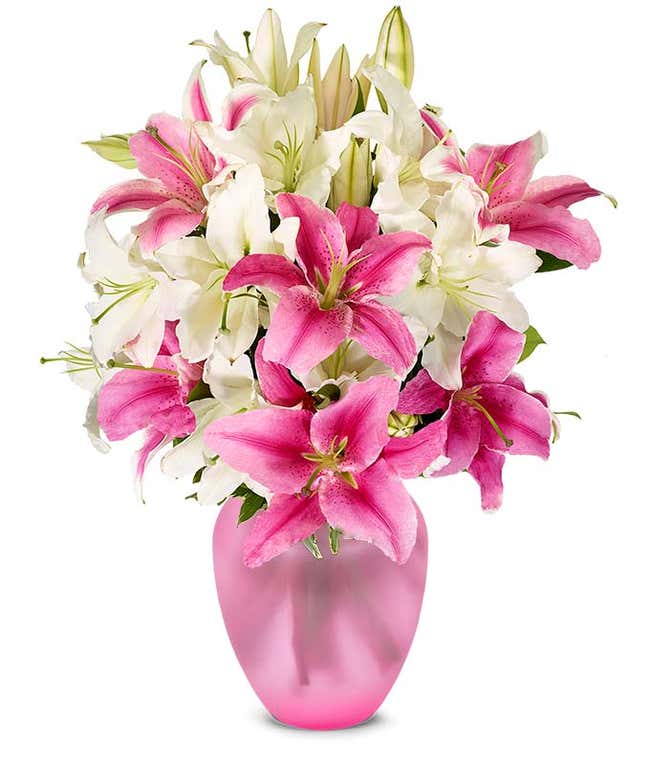 A bouquet featuring pink lilies and white lilies, with an optional glass vase.