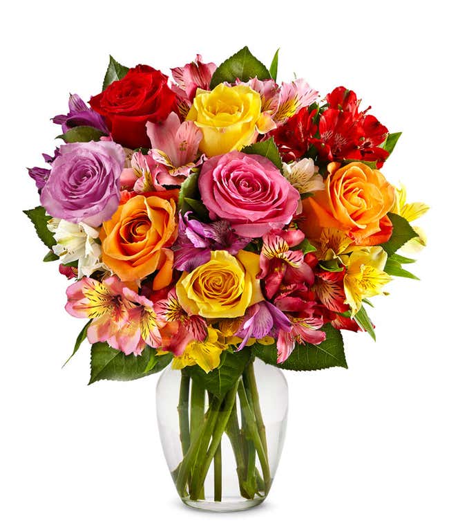 A beautiful arrangement featuring mixed roses and assorted alstroemeria, optionally presented in a glass vase. This vibrant mix offers a colorful and cheerful display, perfect for any occasion.