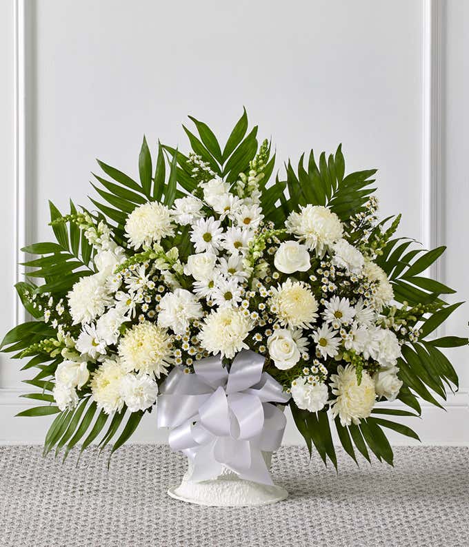 White sympathy basket with white roses and spider mums